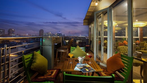 Hotel terrace with view over the city at night